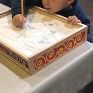 Child playing in a sandbox